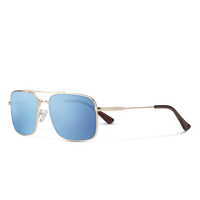 Sunglasses with gold frame and blue lenses on a white background