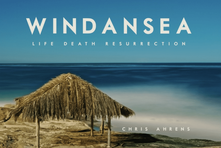 Book cover of 'Windansea: Life Death Resurrection' by Chris Ahrens with a beach scene and straw hut.