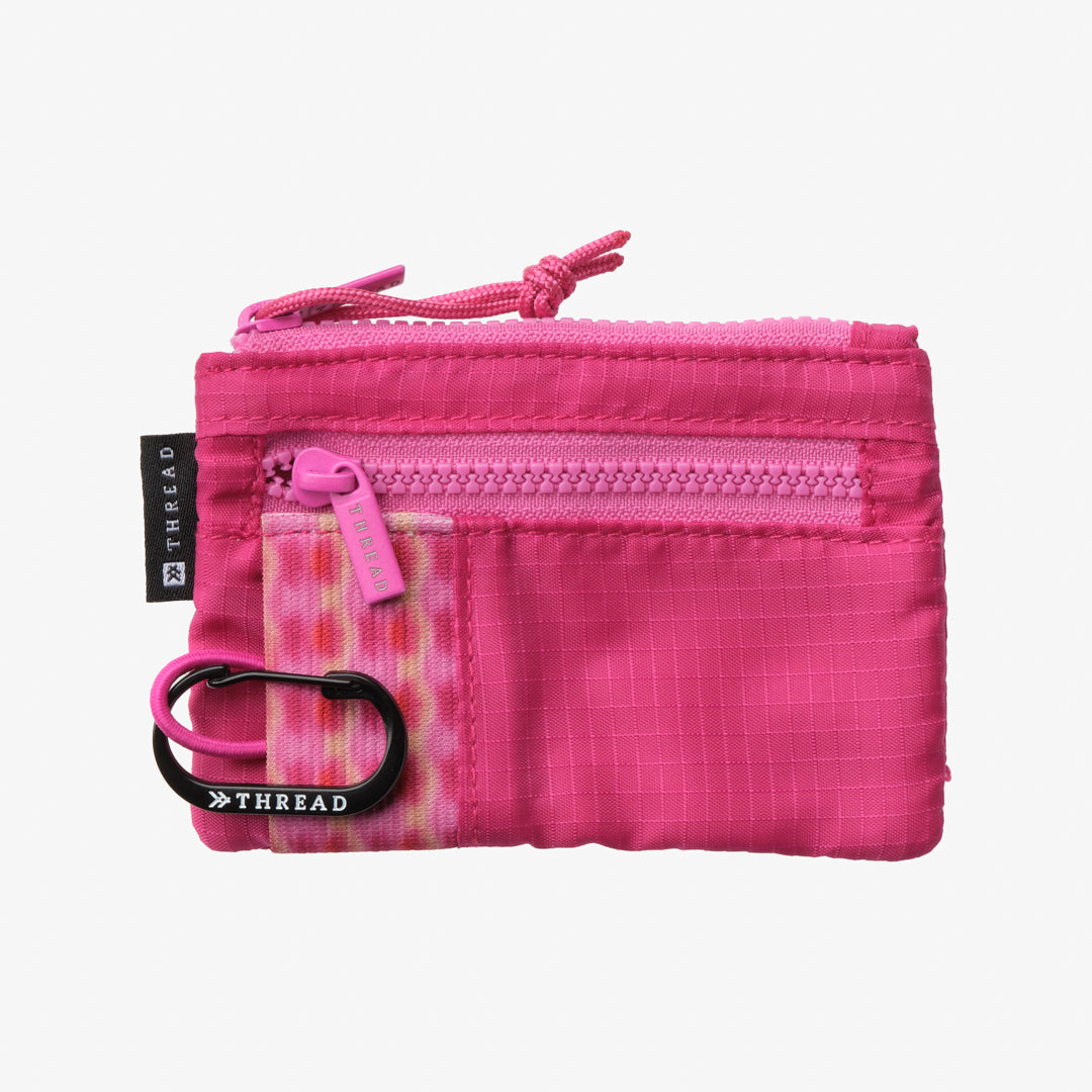 Pink zippered pouch with a carabiner on a white background