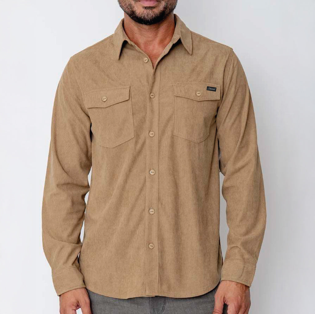 Man wearing a brown button-up shirt with a visible brand logo on a white background