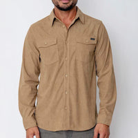 Man wearing a brown button-up shirt with a visible brand logo on a white background