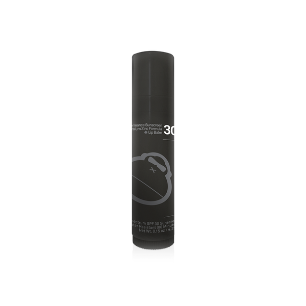 A tube of Sun Bum Signature lip balm with SPF 30. The packaging is black with white and grey text and graphics, including the Sun Bum logo.