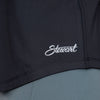 Close up view of Stewart logo on lower left hem of tank top